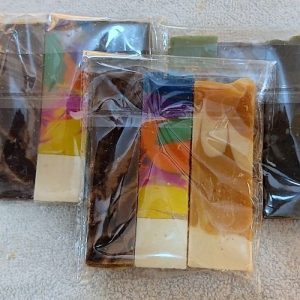 four free sample natural bar soaps packed in a nylon